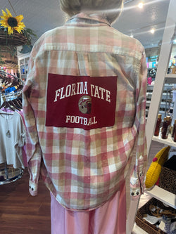 Plaid shirt with Florida State Football logo in a store setting